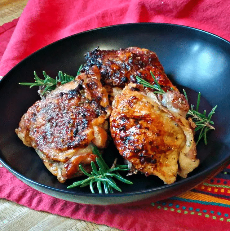 A Flavorful Feast Sweet & Savory Honey Garlic Chicken with Fresh Rosemary.